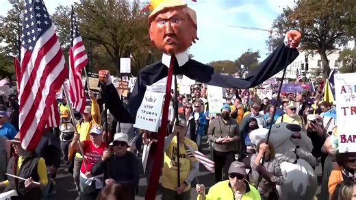 Demonstrators marched and chanted against the Trump administration in Washington, D.C., as thousands of planned "No Kings" protests unfolded in other parts of the United States and abroad. | Reuters