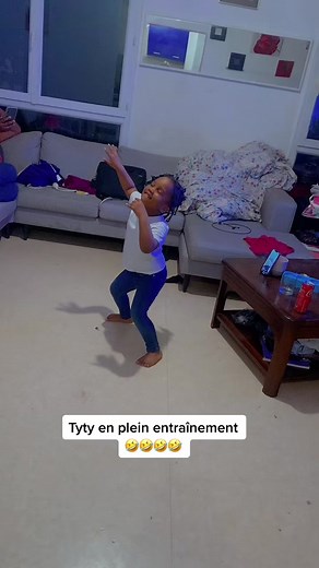 Child Dancing in Living Room: Fun Moments Captured