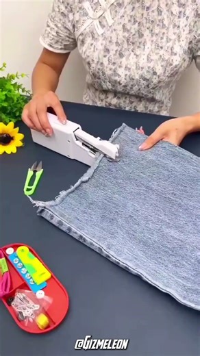 Handheld sewing machine