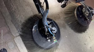 Automatic sweeping street machine that works in the evening on the road, modern technology for cleaning sidewalks from debris and dust Stock Video