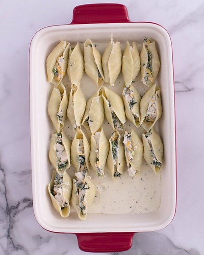 These stuffed shells are overflowing with bacon-ranch goodness. Chicken-Bacon-Ranch Stuffed Shells recipe: https://www.bettycrocker.com/recipes/chicken-bacon-ranch-stuffed-shells/eb050854-1c51-424a-a2b9-931a1fcf0b79?utm_medium=social&utm_source=facebook&utm_campaign=05_2018_standard?mktgimp=PROBROTH?mktgimp=GOLDMFLR?mktgimp=CFFROZ | Betty Crocker