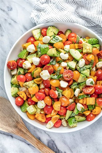 Caprese avocado salad takes everything you love about the classic—juicy tomatoes, fresh mozzarella, and basil—and adds creamy avocado for an extra boost. It’s fresh, simple, and perfect for warm days. https://thestayathomechef.com/caprese-avocado-salad/ | The Stay At Home Chef