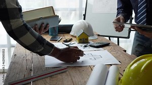 Architecture Engineer Teamwork Meeting, Drawing and working for Architectural projects and engineering tools in the workplace, working ideas on architectural structures.