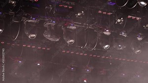 Spotlights with colored filters at the theater or concert hall. Professional lighting equipment.