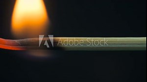 Burning wooden stick, toothpick. Black background. Extreme macro shot