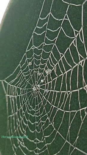 This dew-kissed web was commissioned by a gentleman wanting to surprise his long-distance girlfriend. He chose her favorite color as the background and it was the sweetest thing ever! (hopeless romantic here) | Thread Handed Jill