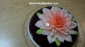 4.5M views · 84K reactions | Learn How To Make Gelatin Art Cakes and Save Money This Holiday Season! For under $5, this cake makes a wonderful and delicious Christmas dessert and an amazing gift. https://gelatinartmarket.com/blogs/news/simple-and-inexpensive-one-flower-cake | Gelatin Art Market | Facebook
