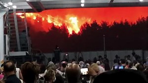 Residents flee Greek island engulfed in flames