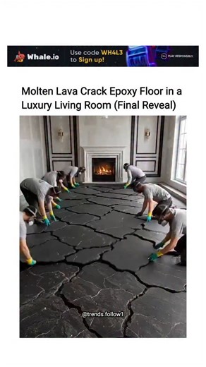 Viral Trending content on Instagram: "The post showcases a 23-second time-lapse video of professionals installing a molten lava-effect epoxy floor in a luxury living room, transforming plain concrete into a glossy black surface with glowing orange cracks illuminated by embedded LED strips. This flooring technique uses metallic epoxy resin mixed with pigments and heat for the crack pattern, creating a durable, non-slip finish popular in contemporary designs, as seen in numerous online tutorials f