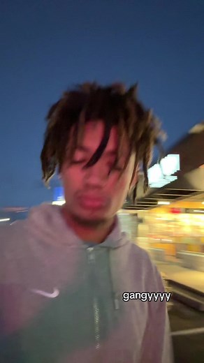 Urban Walking Adventure with Dreadlocks in Evening