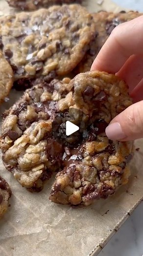Britt Berlin | easy vegan recipes for home bakers on Instagram: "Molten ‘Brown Butter’ VEGAN Oatmeal Chocolate Chip Cookies!! Absolutely no eggs, dairy free, and they taste better than your favorite bakery. Deliciously rich, nutty, chewy, and loaded with chocolate chips, the dough is made in just one bowl and using classic pantry staples, but instead of eggs and butter, we’re swapping in dairy free yogurt and vegan butter. SO EASY!! COMMENT “vegan oatmeal cookies” and I’ll send you the full reci