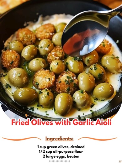 Fried 😻 Olives with Garlic Aioli 🫒✨ Deliciously crispy olives paired with creamy garlic aioli! 📋 Ingredients - 1 cup green olives, drained - 1/2 cup all-purpose flour - 2 large eggs, beaten - 1 cup breadcrumbs - 1/2 cup mayonnaise - 2 cloves garlic, minced - 1 tablespoon lemon juice - Salt and pepper to taste ..... Full Recipe in Coʍmеոτ 💬 ☺️ | Creative Cookery With Grandma's