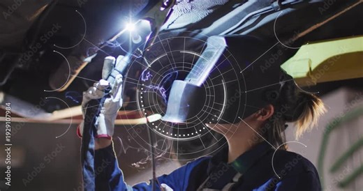 Auto technician welding under lift activating torch, HUD aligning, sparks flaring, fixing seam