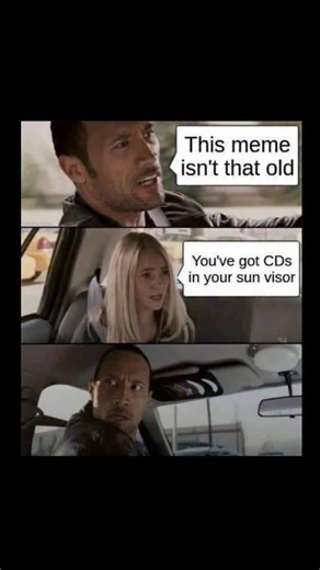 Johnny Bravo Explains Memes on Instagram: "Hey everyone, Johnny here to explain. This meme jokes about how “not that old” you actually are by using a sudden, painfully specific nostalgia trigger: in the first panel, someone casually says “This meme isn’t that old,” implying it’s still recent and relevant, but in the second panel the girl counters with “You’ve got CDs in your sun visor,” which is an extremely millennial-coded detail from the early 2000s when people burned mix CDs and stored them