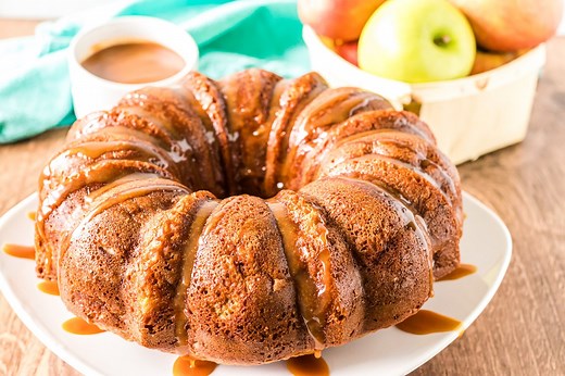 Easy Autumn Caramel Apple Pecan & Cinnamon Spice Bundt Cake is so easy to make. Serve it warm with vanilla ice cream drizzled in caramel. Full recipe > https://www.persnicketyplates.com/easy-autumn-caramel-apple-pecan-cinnamon-spice-bundt-cake/ | Persnickety Plates