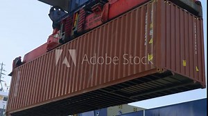 4K actual cam footage of crane port lifting down red container on cargo trailer stock video.