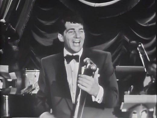 Dean Martin - That's Amore (1953) The 1950s was a golden era for music, marked by an explosion of diverse genres and timeless classics. Amidst this rich tapestry of sound, Dean Martin's "That's Amore" emerged, capturing the hearts and minds of listeners with its infectious melody and evocative lyrics. From the moment the song begins with the iconic line, "When the moon hits your eye like a big pizza pie, that's amore," it transports listeners to the romantic streets of Italy. The song paints a v