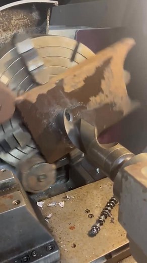 Rough drilling a mounting plate, 3” hole. This is done on the Harrison 550 CNC lathe, due to the size and weight of the part. The round pieces are counter weights, otherwise the piece would accelerate rapidly as the heavy end goes over center. The lathe computer would interpret this as a runaway spindle, and automatically shut down. | Doug Lewis