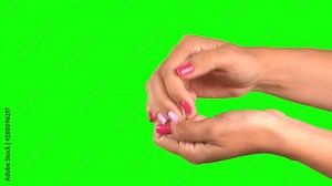 Closeup side view of beautiful female hands in different gestures. Female hands protecting invisible object first, the opens cupped hands and demonstraits virtual object, then coveres hands again. 4k