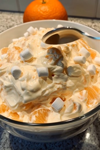 Creamsicle Orange Fluff = A Bite of Sunshine! Here’s a sneak peek at what you’ll need: - Orange gelatin vanilla pudding mix - Cool Whip for that dreamy fluff - Mandarin oranges crushed pineapple - Mini marshmallows (because yes!) Check the comments for the full details! | Mom's Kitchen Notes