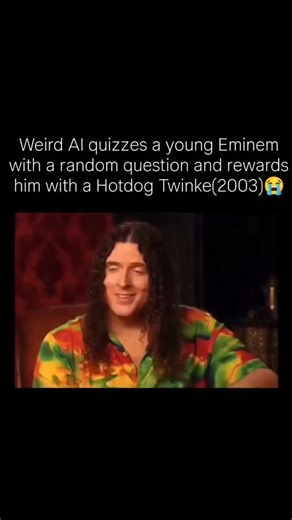 Gagy on Instagram: "In 2003, Weird Al Yankovic interviewed a young Eminem, creating one of the most chaotic and hilarious moments in early 2000s pop culture. During the segment, Weird Al asked Eminem a completely random math question with no context or setup—and Eminem, surprisingly, answered it correctly. The reward? A hotdog Twinkie, an absurd prize that perfectly matched the unpredictable energy of the interview. What makes this clip so iconic is Eminem’s straight-faced seriousness paired wit