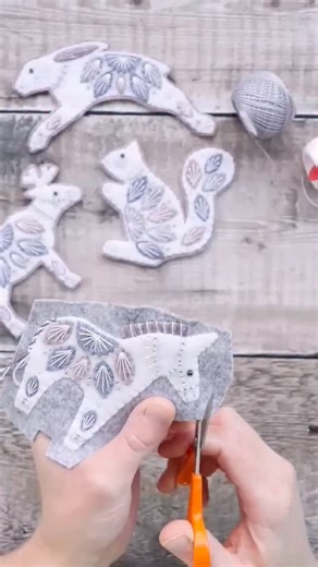 Trimming around a little donkey 🫏 from my shop update earlier this month 🥰 His tail tassel hadn’t had its final trim at this point - I tend to leave doing this til last, to reduce the chances of it going ‘fluffy’ as I handle the decoration to work on it 😊 | Chloe Redfern Embroidery