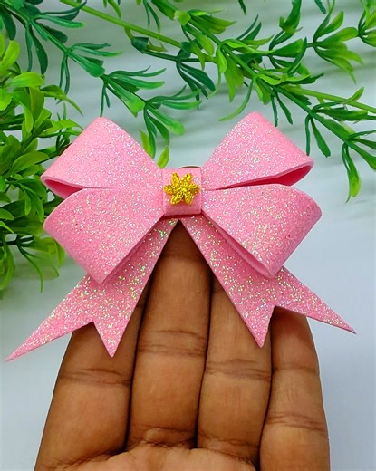9.5K views · 117 reactions | In this step-by-step tutorial, we'll show you a simple technique to create stunning bows using just paper. This is a perfect and budget-friendly way to add a personal touch to your holiday gift wrapping and home decor. #diychristmas #christmasdecorations #bows | Origami Art & Crafts | Facebook