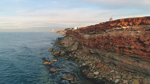 Lighthouse in the distance - Free Stock Video