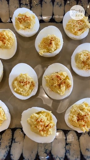 The velvety filling in these million-dollar deviled eggs is INCREDIBLE! Full recipe here: https://trib.al/wAy9Lvp #deviledeggs #appetizerrecipe #appetizerideas | Taste of Home