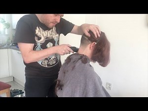 A graduated bob haircut with undercut shaved nape