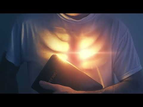 Bible Against Man's Chest Emitting Glowing Holy Spirit Light Of Christ 4K Christian Worship Loop