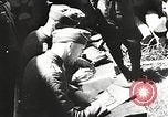 1941 – Soviet Union: German officers interrogate Soviet prisoners and aircraft strafe Soviet positions in the Soviet Union during World War II.