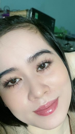 Close-Up Portrait of a Woman with Pink Hair Clip