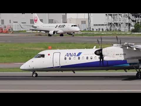 ANA DHC-8-400 JA853A｜街並みを背に伊丹空港へ着陸