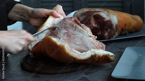 Step-by-step recipe for pork knuckle roll, female cook separates skin from pork shank, ketogenic diet, low-carb diet, selective focus