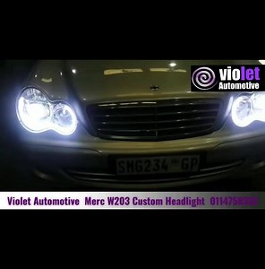 Merc W203 C Class custom headlight designed by Violet Automotive. Customer wanted best output lightning therefore we chose a high performance bi-xenon projector for proper light output. We fitted super white angel eyes with a white amber DRL tube with enough curves to draw attention to the headlight work. As the original headlights were worn and had wiring issues, we fitted our custom work onto a brand new set of quality aftermarket headlights. To ensure long lifespan of the headlight we applied