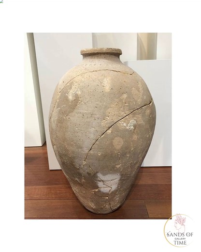 A large Canaanite Terracotta Pithos, Iron Age I-II, ca. 1400 - 800 BCE Buy Now! https://sandsoftimedc.com/products/mp1814 A pithos is a very large container whose shape clearly indicated that it was used for domestic storage. It probably had its place in one of the rooms of the house or in a corner of the courtyard and served to store liquids or dry substances. This large example features a rounded body that gradually tapers to a small flattened base, intended perhaps to be sunk into the floor. 