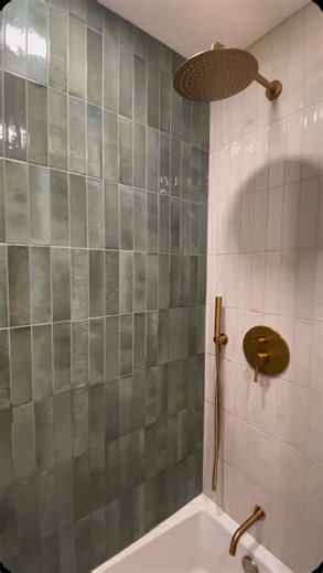 A drastic bathroom transformation that perfectly represents the appeal of mixing textures and colors 🌿 Shower Walls: Home Brick 2x10 in Forest and Milk. Floor Tile: Vincent Stone 12x24 in White. | The Tile Shop