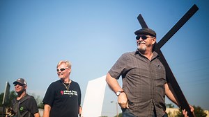 Bearing the cross down Anderson's Main Street