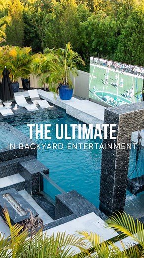Our team doesn’t just build pools — we create full outdoor living experiences. Join Chris from our sales team as he takes you behind the scenes of this stunning project, complete with a custom pool, spa, and outdoor kitchen. This backyard features a marble deck lined with turf, a pergola with a retractable sunshade, LED lighting throughout, and a 360° champagne spillover spa. Highlights include dual sunshelves with bubblers and river rock, sleek black and white finishes, Ledge Loungers, a rain c