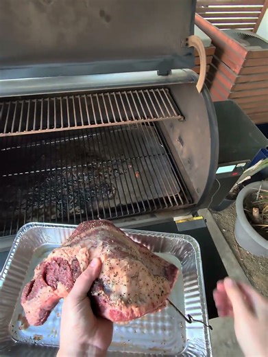 Loading wagyu brisket into my Traeger smoker