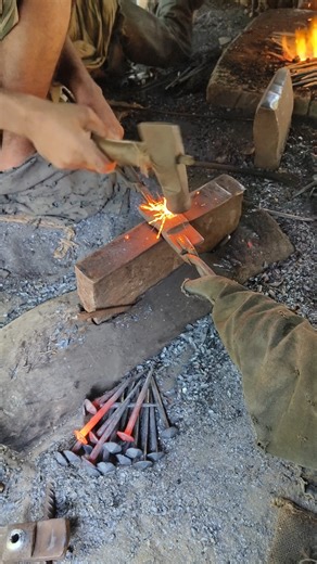 How a blacksmith forges iron to make nails #blacksmith