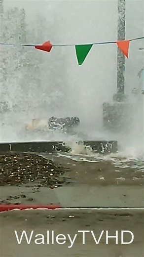 Car hits fire hydrant LOL