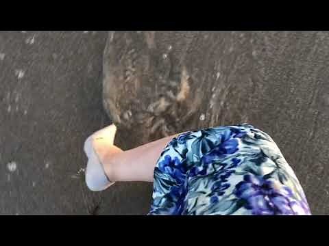 High heels in the water at the ocean