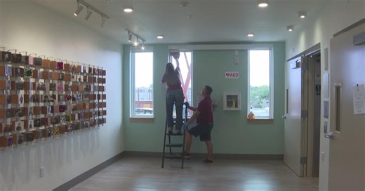 Xcel Energy volunteers giving back by cleaning windows and space at local homeless outreach center