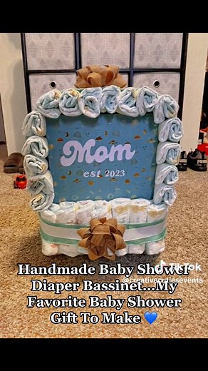 Handmade diaper bassinet/stroller for a baby shower gift. I love making these diaper cakes they are a must for every baby shower!!! #handmadegifts #diapercakemadebyme #diapercake #babyshower #customdiapercake #babyshowergift #handmadecraftsforsale #smallbusiness