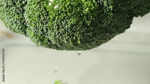 As oil flows over broccoli, it speaks to the enhanced flavors and nutritional boost that broccoli seed oil offers, including its use in gourmet cooking and skin care.