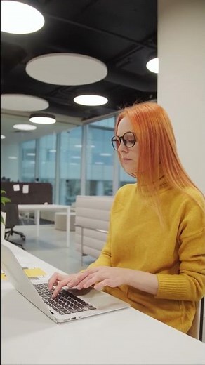 Girl is typing while working in the office