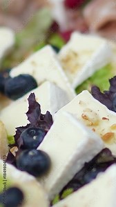 Catering service on banquet table with canape snacks in restaurant or hotel. Decorated food set on birthday, wedding celebration or business conference event venue