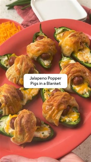 Cheese, spice, and everything nice – Your favorite apps just got a game day makeover with these Jalapeño Popper Pigs in a Blanket Get the full recipe here: http://ms.spr.ly/6182Qzcy2 Ingredients 16 fresh medium jalapeños 1/2 (8 oz) pkg reduced-fat cream cheese, softened 1 1/2 cups shredded Cheddar cheese, divided 1/4 cup chopped green onions 1 tsp garlic powder 1 (14 oz) pkg mini cocktail links 2 (8 oz) pkgs refrigerated crescent dough sheets 1 large egg To cook 1. Preheat oven to 375°F. Line 2 